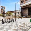 Life size chess set in the lounge/game area 